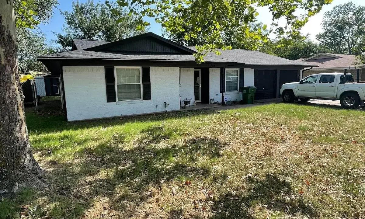 Professional roofing crew working on a residential roof in Channahon